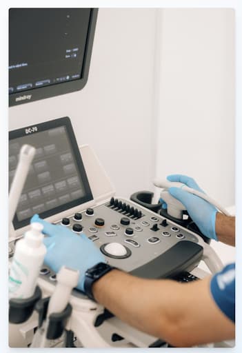 Professional healthcare worker operating a modern diagnostic ultrasound system